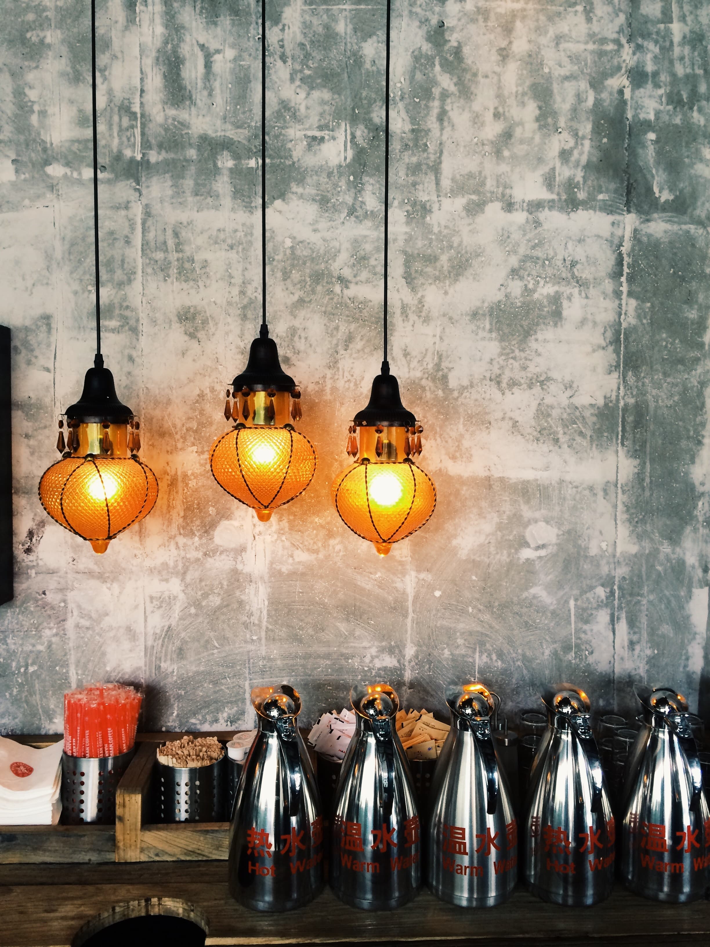 Warm plaster walls with pendant lights